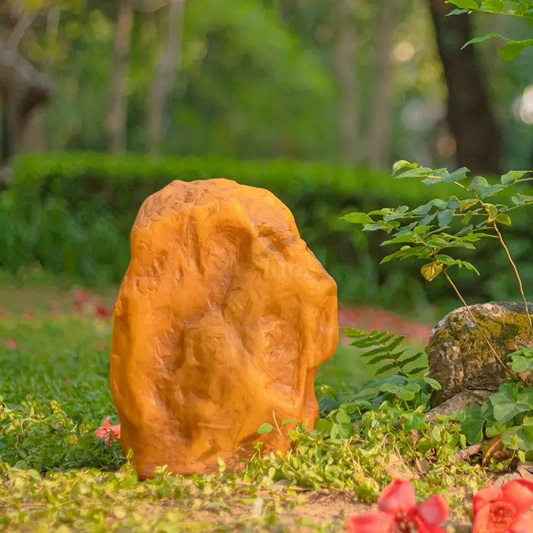 Glowing Stone Garden Lights illuminated at night in backyard garden landscape